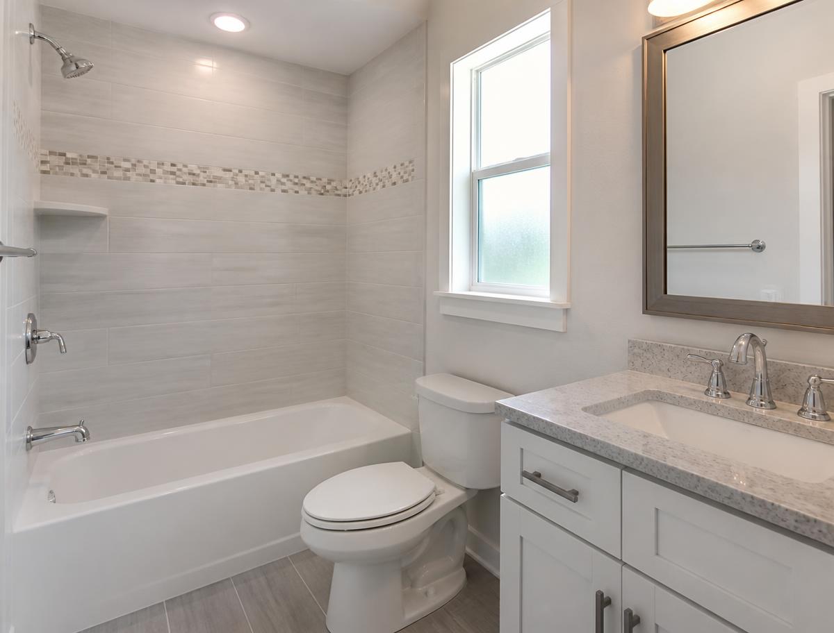 Remodeled bathroom with refaced tub and tiled shower surround