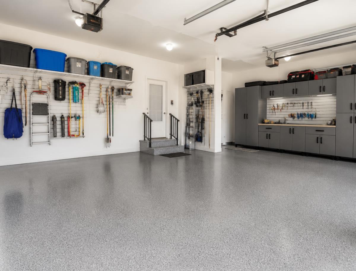 Finished residential garage with epoxy floor and wall storage